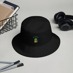 Black Baby Dino Bucket Hat placed on a desk, showcasing its clean design and potential for personalization.