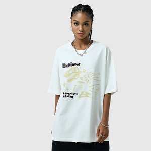 A women wearing the Dino Chill Loose Fit Tee in white, showcasing the relaxed fit and cool dinosaur graphic.