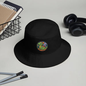 Black Dino Dreamer Bucket Hat placed on a desk, showcasing its clean design and potential for personalization.