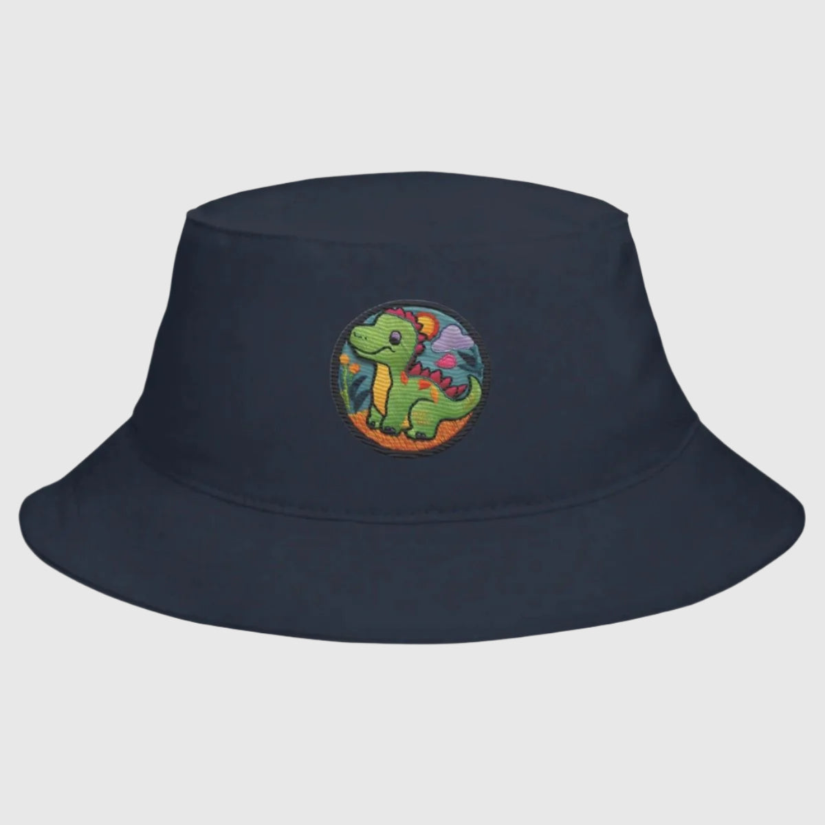 Blue Marine Dino Dreamer Bucket Hat with a close-up view of the playful dinosaur graphic.