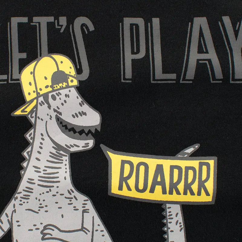 Zoomed-in view of the 'Let's Play! ROARRR' design on the black kids' long sleeve t-shirt, featuring a fun cartoon dinosaur graphic.