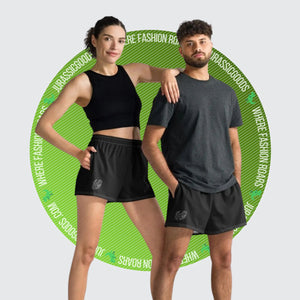 A woman and a boy wearing Primal Performance Shorts, showcasing the comfortable fit and versatile style for all ages and genders.